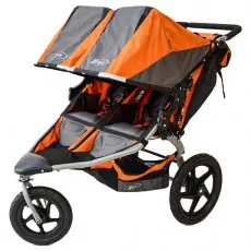 A stroller with two seats and wheels on it.